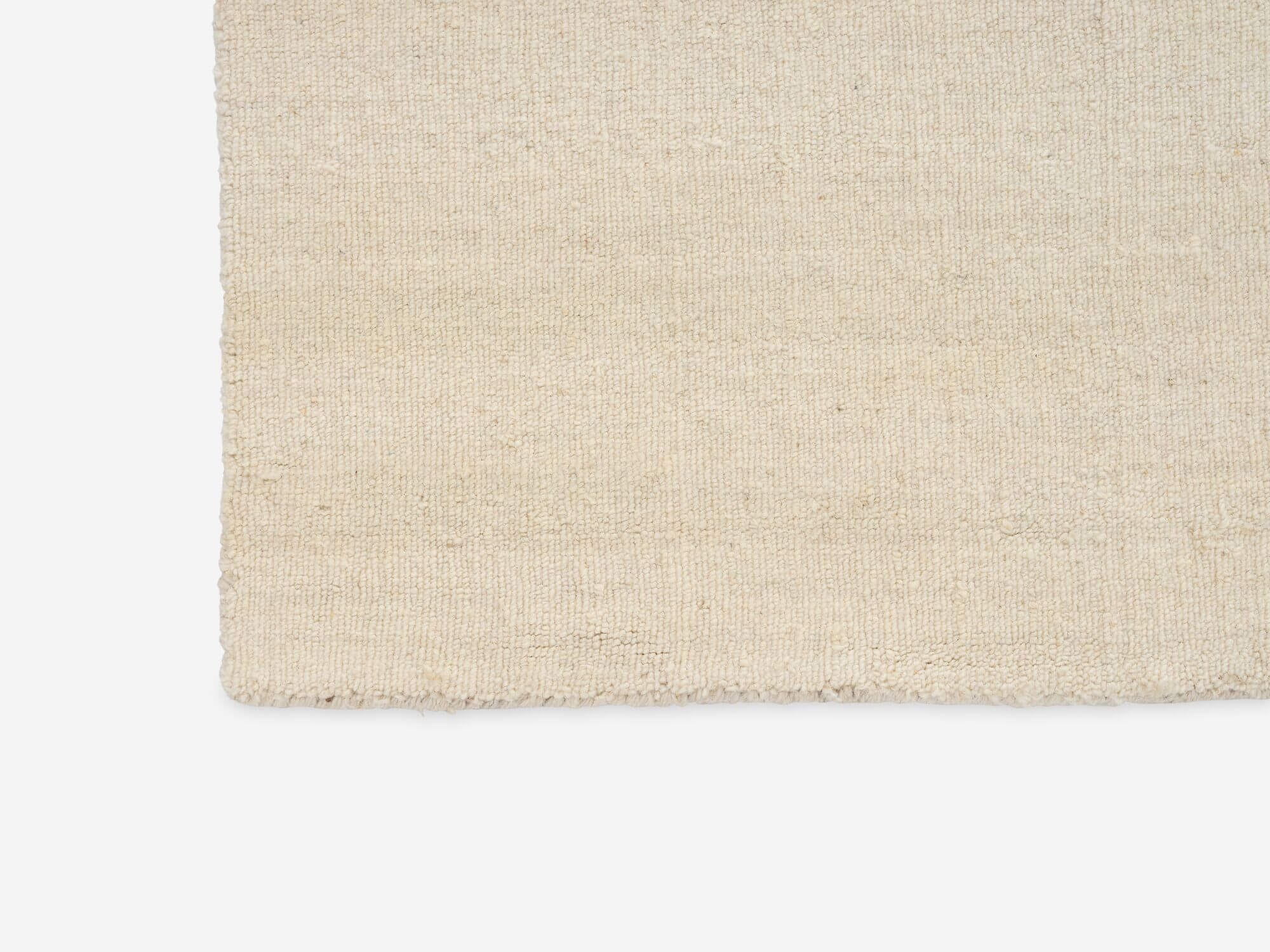 Detail view of large beige and black abstract pattern area rug